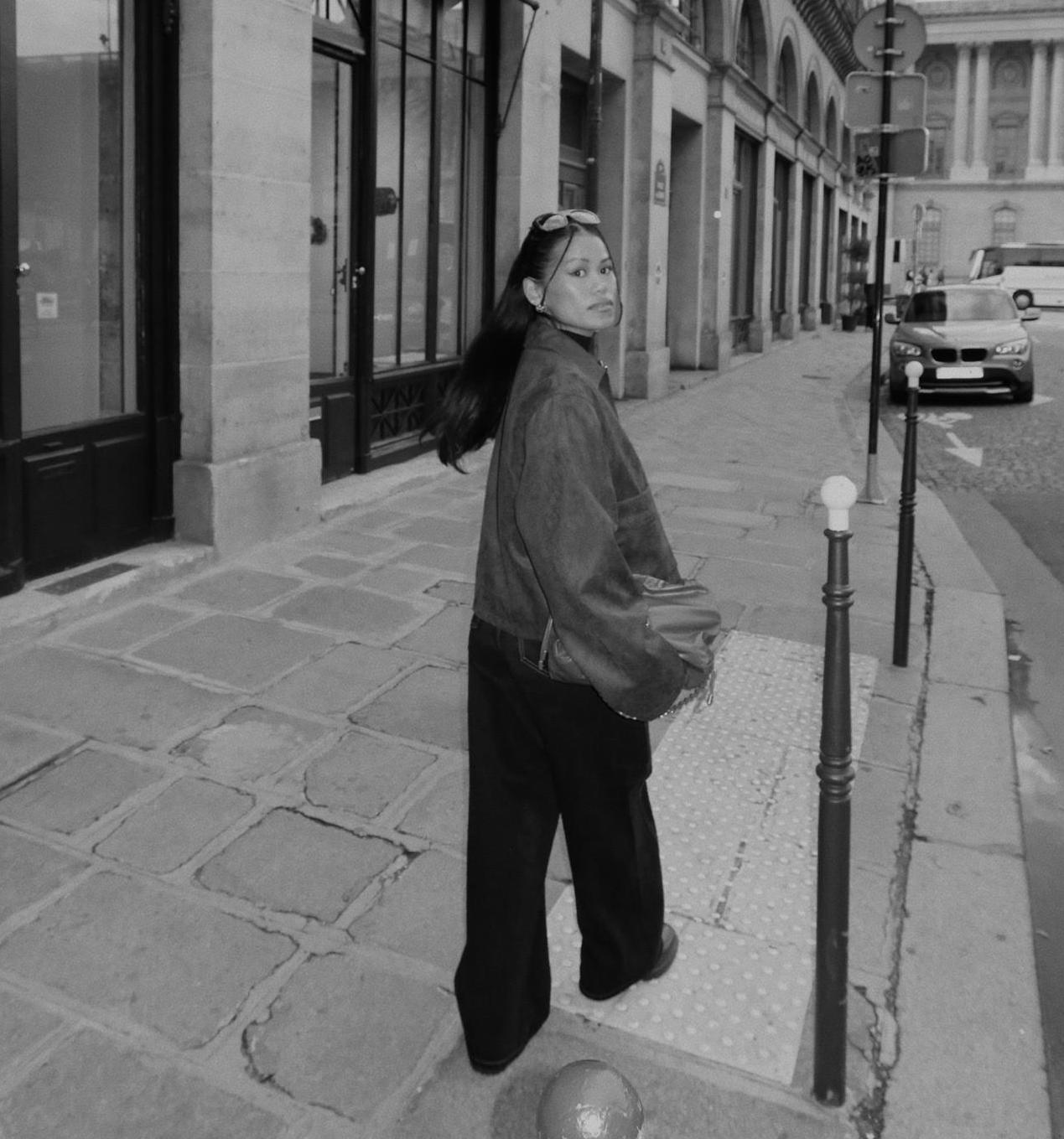 Alaine on a Paris street in a leather jacket